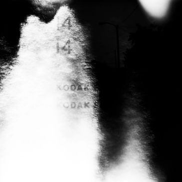 Black and white abstract image with numbers and light contrast.