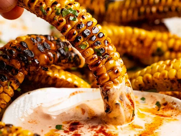 Crispy Corn Ribs, fried then tossed in garlic butter oil, and topped with parsley. 