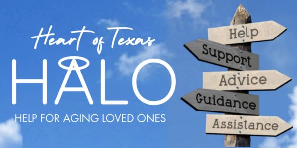 Heart of Texas HALO support signpost against blue sky.