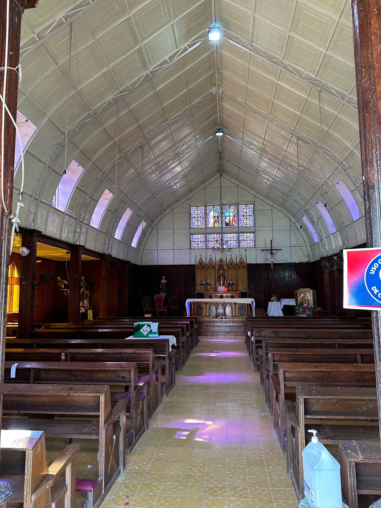 Inside the church which is constructed of metal.