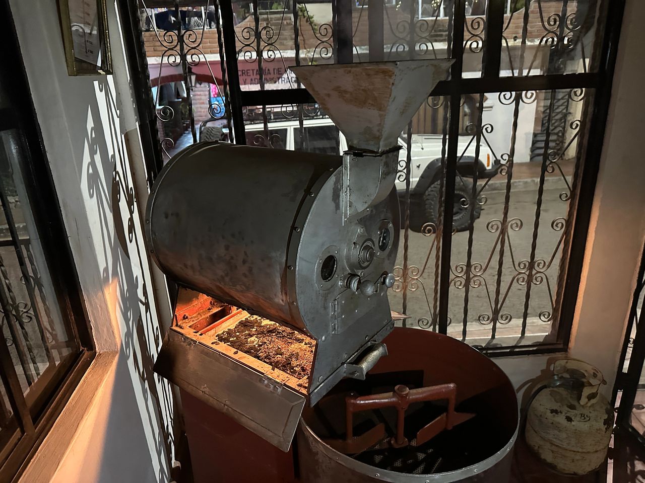 Checking out the vintage coffee roaster in operation. Checking out the vintage coffee roaster in operation.