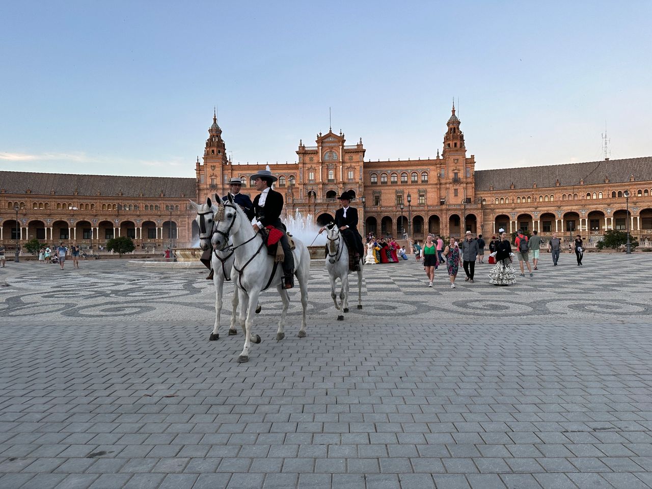 There were several horses with riders dressed in traditional clothing throughout the city.