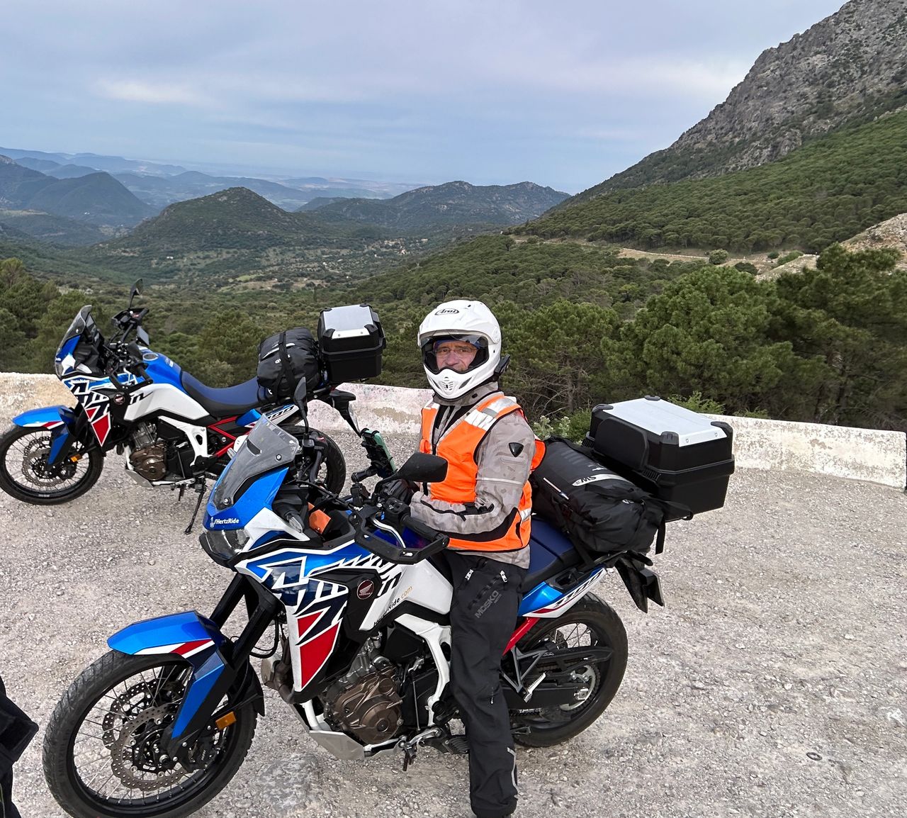 A helmet can't hide the smile from riding these roads!