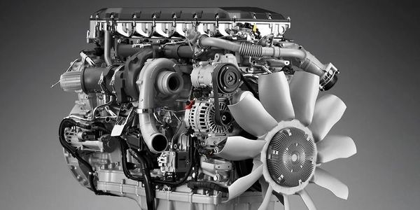 High-performance diesel engine with cooling fan and turbocharger.