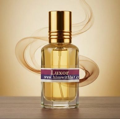 Elegant Luxor perfume bottle with golden cap and swirling scent design.