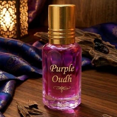 Elegant Purple Oudh perfume bottle with golden cap on wooden surface.