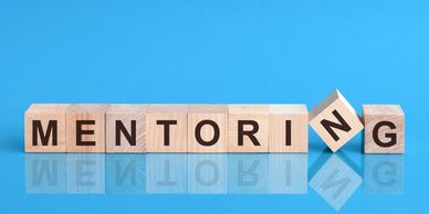A blue background with word mentoring