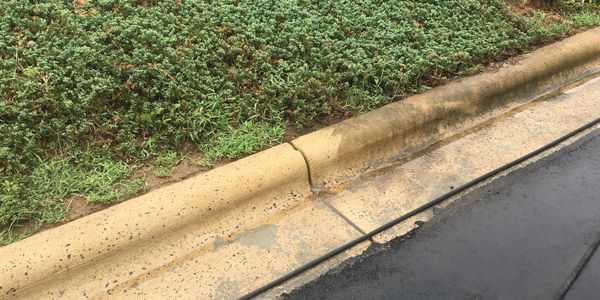 Pressure washing a commercial curb in Charlotte adds, well, curb appeal!