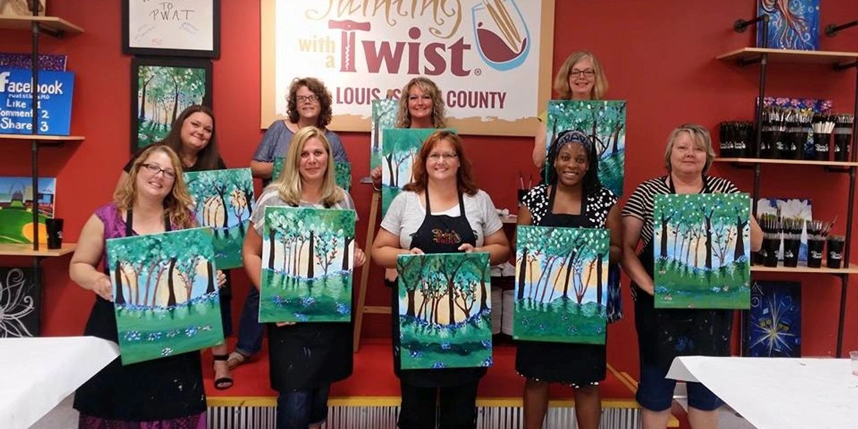 Group of women proudly displaying their tree paintings at a painting class.