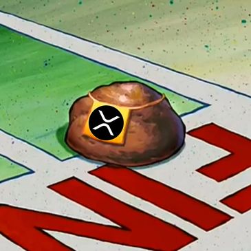 A golden spatula with a Ripple logo on a rock from SpongeBob SquarePants.