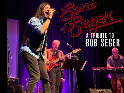 Band performing a tribute to Bob Seger on stage.