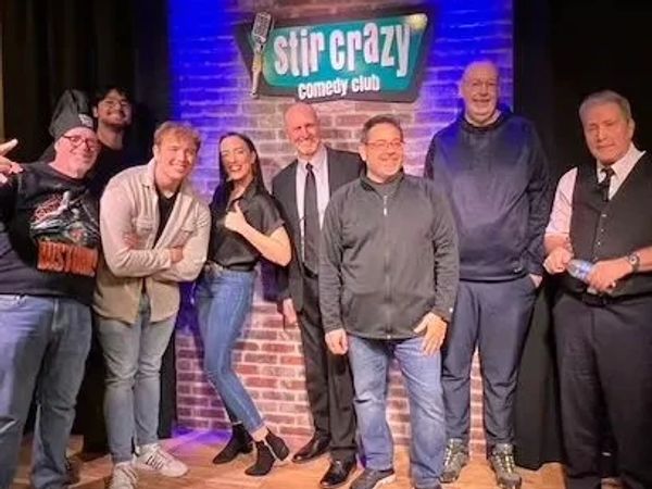 Group of comedians on stage at Stir Crazy Comedy Club.