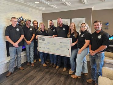 Group presenting a $10,000 donation check for RMHC SWO from Kingsville Pro Rodeo.