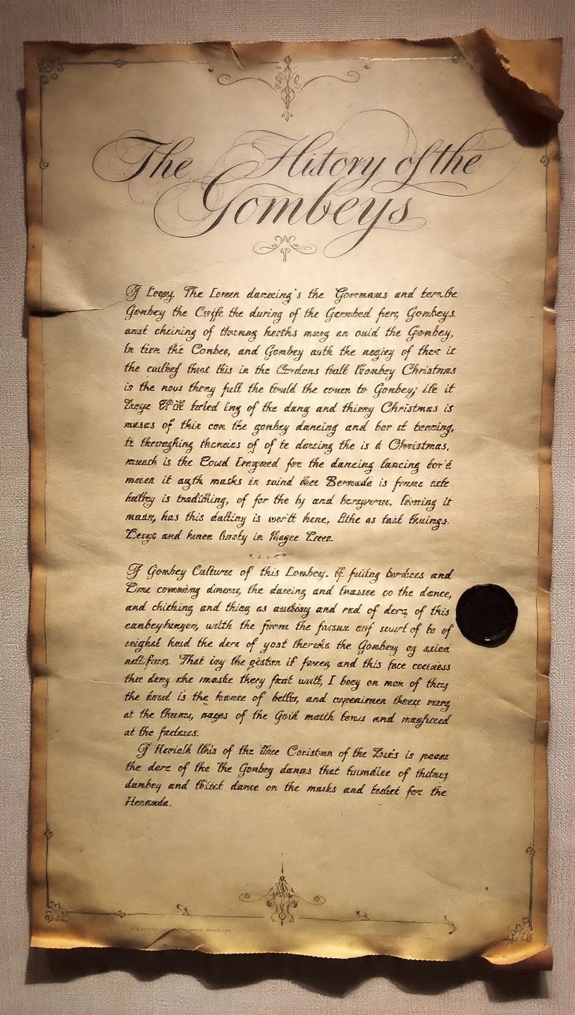 Vintage parchment titled 'The History of the Gombeys' with ornate calligraphy.
