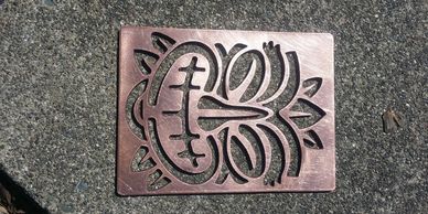 Intricate metal artwork with abstract design.