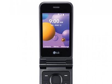 An LG flip phone with a colorful screen displaying time and menu options.