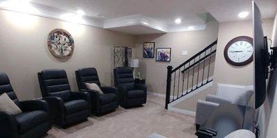 Unfinished basement turned into a TV and sitting room. 