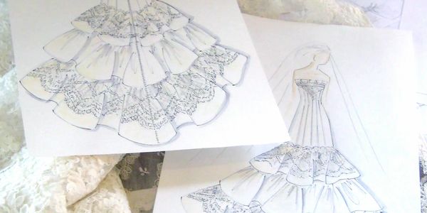 Suzanne Perron St. Paul fashion designer sketches her own bridal gown designs.