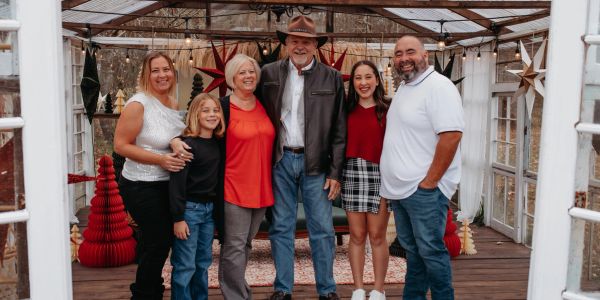 A family posing together in a festive setting.