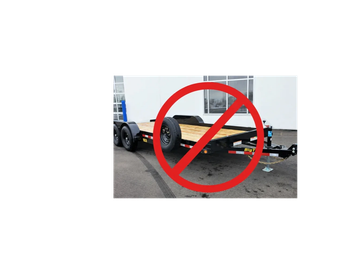 Trailer chassis with a large red prohibition sign over it.