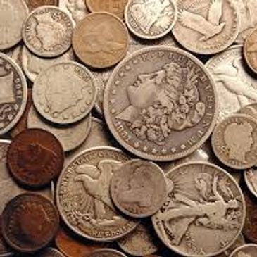 A collection of various old and worn coins.