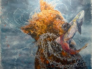 A bear catching a fish in water with splashes all around.