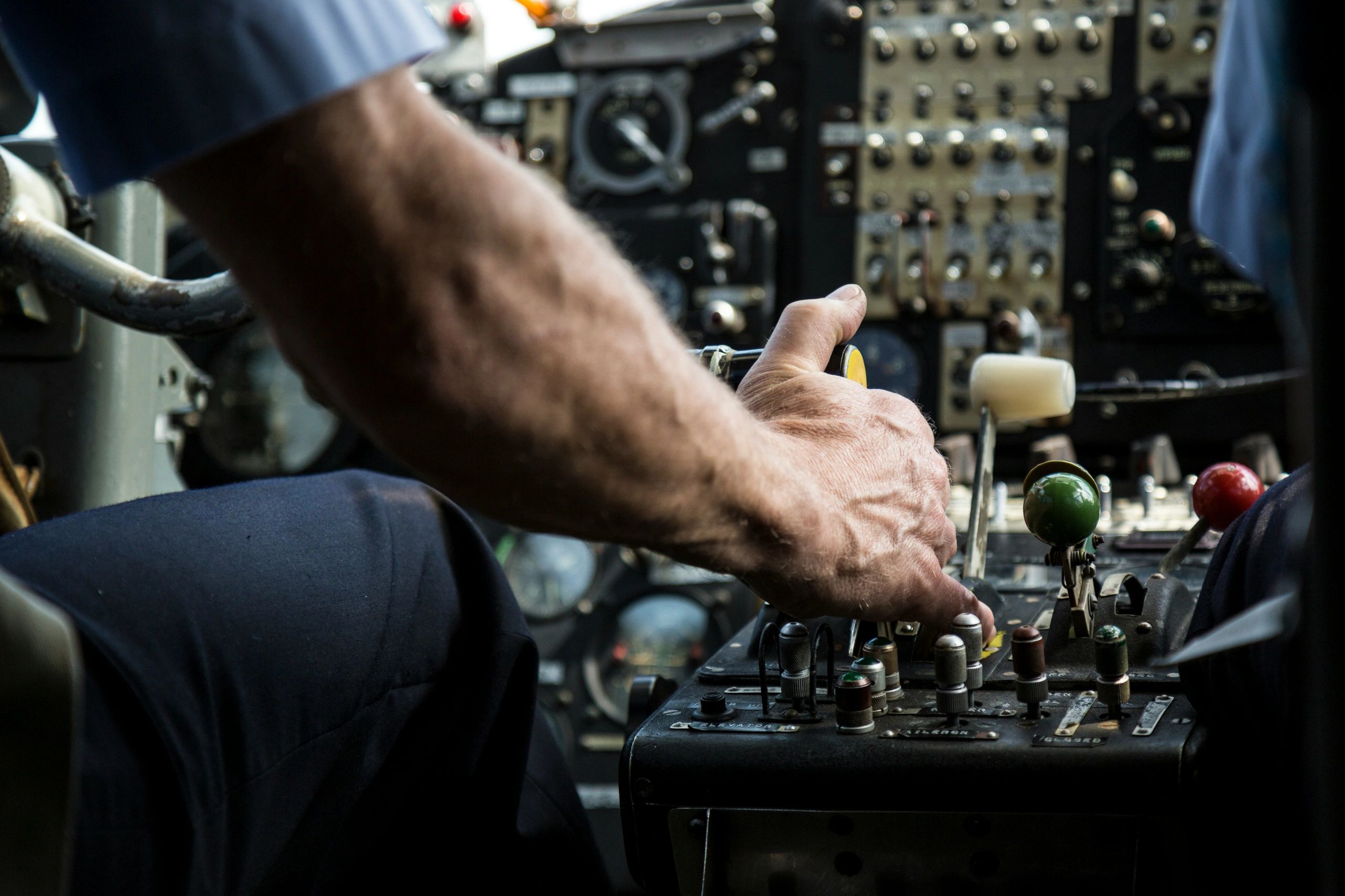 Pilot gripping controls and preparing for takeoff
