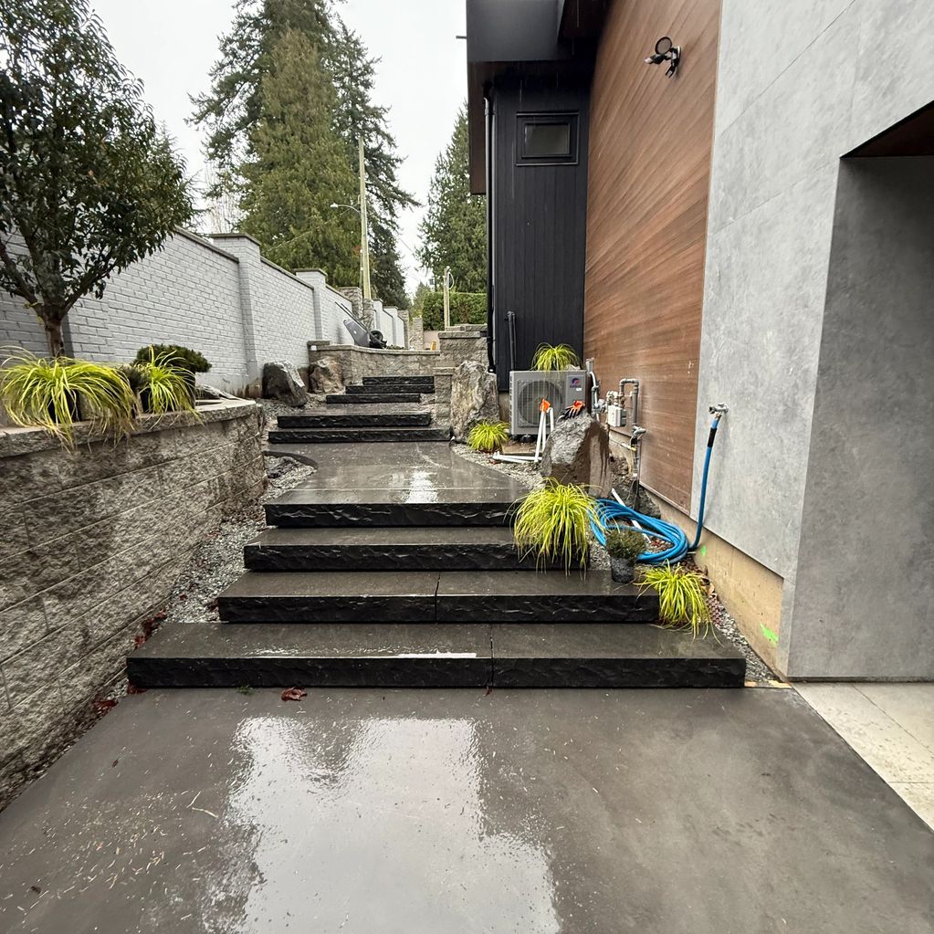 Live wedge Basalt steps placed with precision to create a bullnose effect .