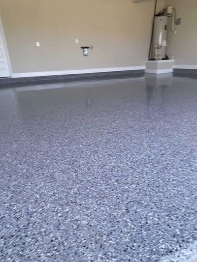 Garage Epoxy flooring with epoxy flooring flake color blue, black, and white.