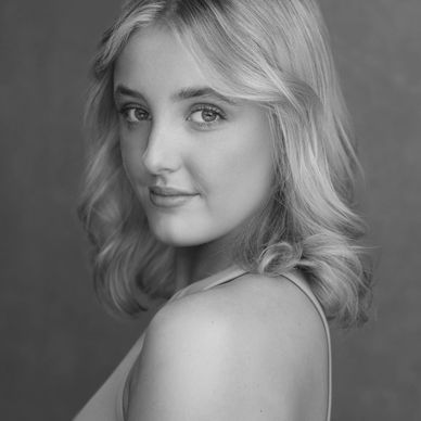Black and white portrait of a young woman with shoulder-length hair.