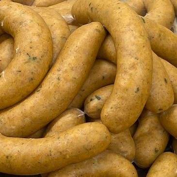 Foreman's Original Recipe Boudin piled on a table right after being stuffed.