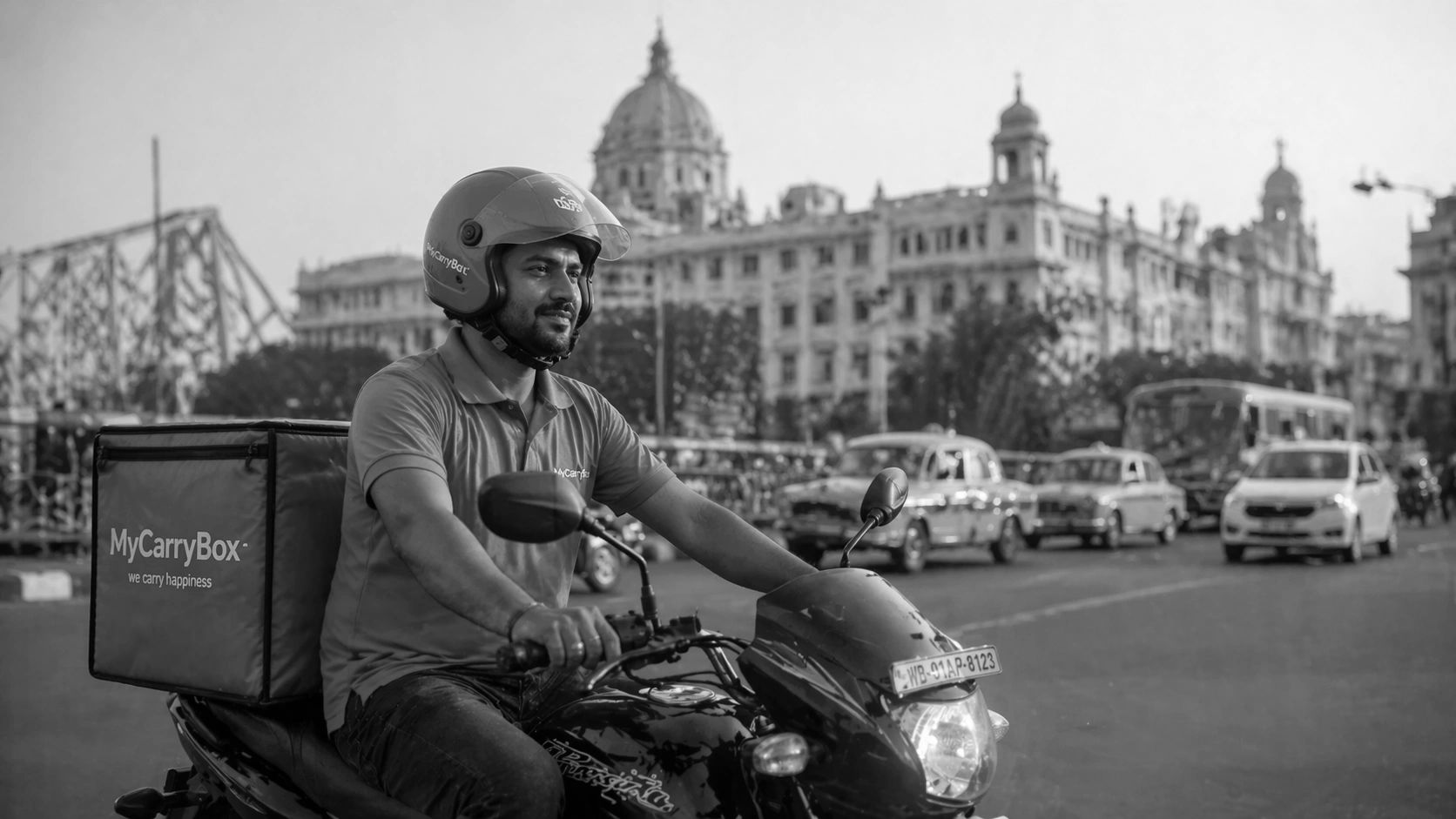 Delivery man riding a motorcycle with MyCarryBox in a city.
