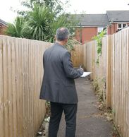 LOCA Housing Project Worker carrying out a local environment inspection.