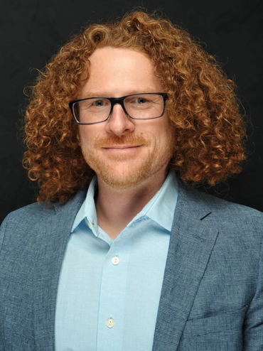 Professional headshot photo taken onsite at a trade event
