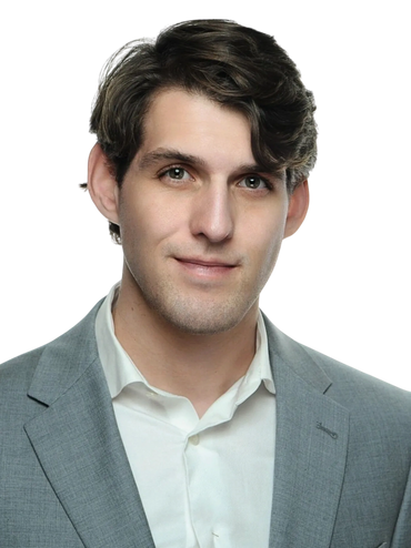 Professional headshot photo taken at a trade event. 