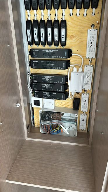 Organized electrical panel with voltage drivers and wiring.