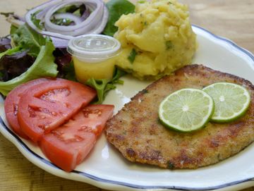 Schnitzel or Wienerschnitzel with potato salad and sauerkraut