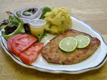 Schnitzel or Wienerschnitzel with potato salad and sauerkraut