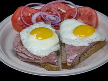 Leberkaesse ( German Meatloaf) Breakfast on Rye bread with Sunny Side Up Eggs
