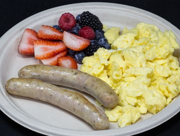 Nurnberger breakfast with scramble eggs and fruit cup