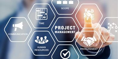 Businessman pointing at project management concepts on a transparent screen.