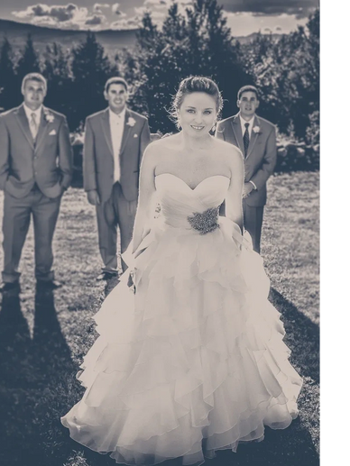 Black and white image of a bride and the grooms men are in the background. Stone Mountain Art center