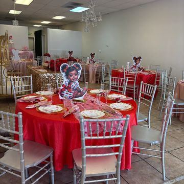 Children's party setup with red and gold decorations.