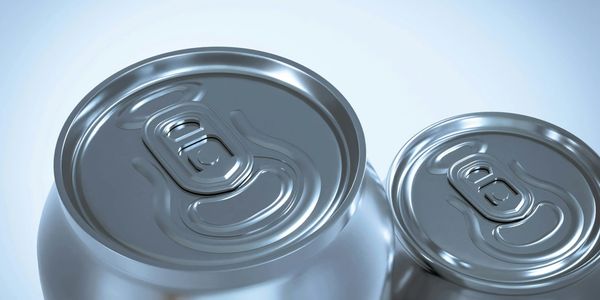 Close-up of two unopened silver beverage cans with pull tabs.
