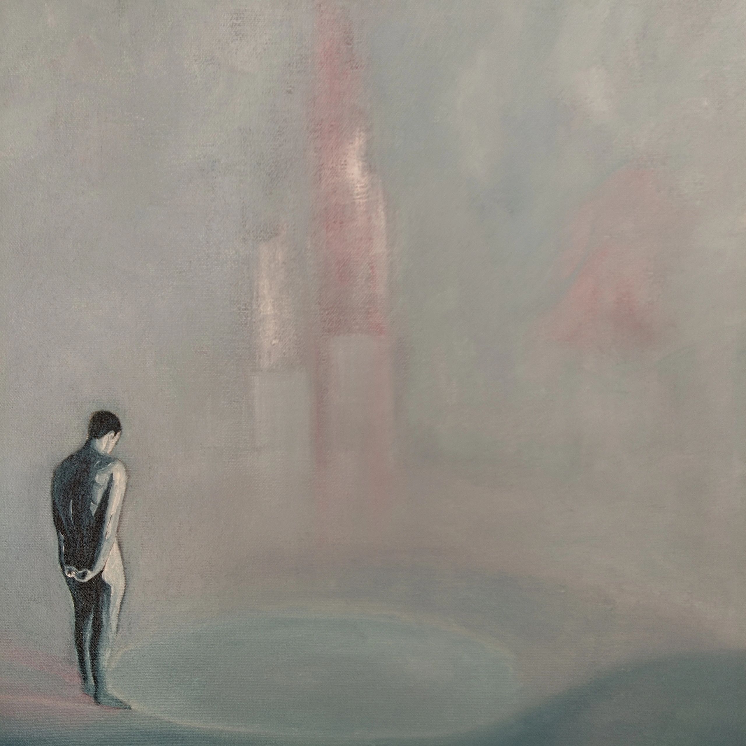 Image of standing male figure with back to the viewer gazing into misty landscape.