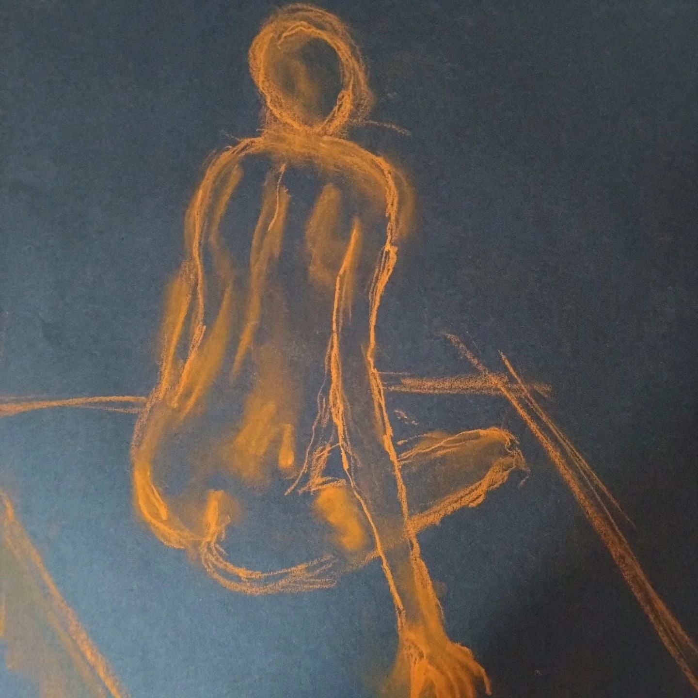 Seated female model back view- life drawing  conte crayon on black paper.