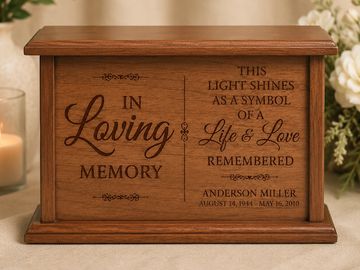 Wooden memorial box with engraved loving memory message and dates.