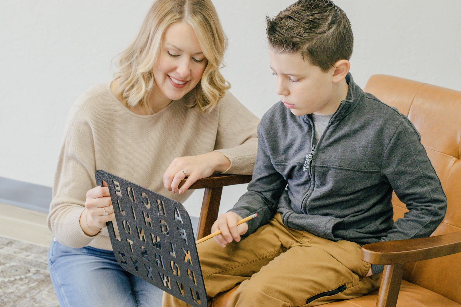 Miranda and Taft using a spelling board.