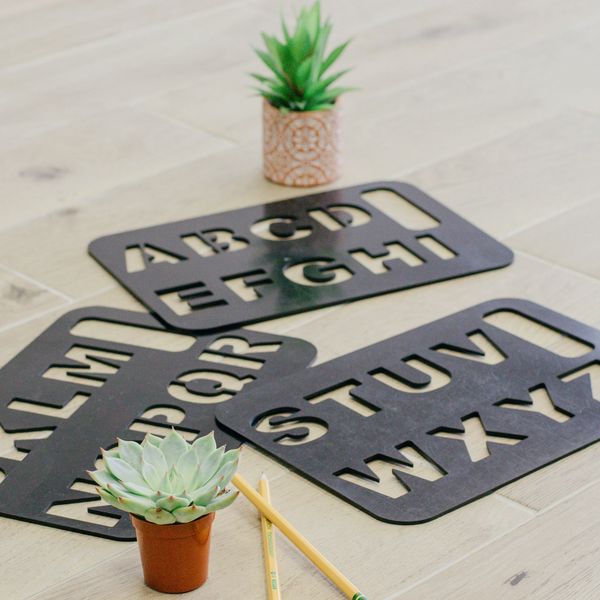 Flat lay picture of Spelling Boards, plus two plants and pencils.