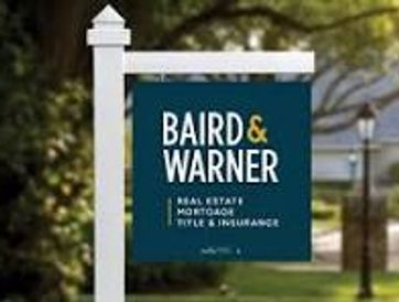 Real estate and mortgage sign for Baird &amp; Warner.